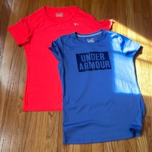 2 Under Armour women’s heat gear tops. Blue and coral size M. Great condition